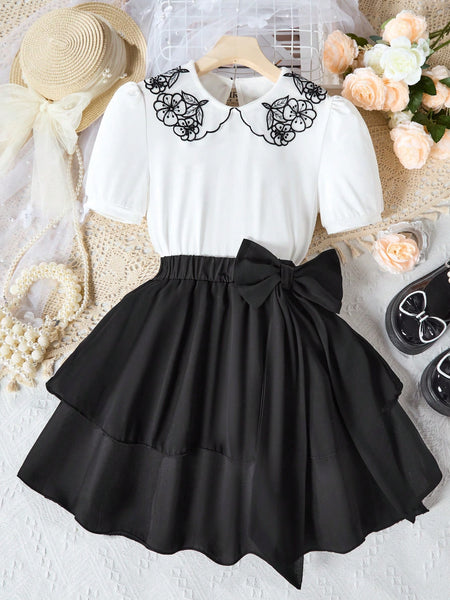 Conjunto de blusa de cuello bordado en negro y blanco