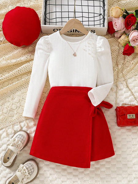 Conjunto de moda con blusa de manga